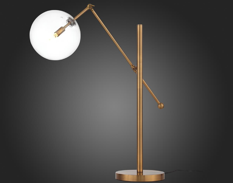 В кабинете не обойтись без настольной лампы, и хорошим вариантом станет лампа с круглым плафоном